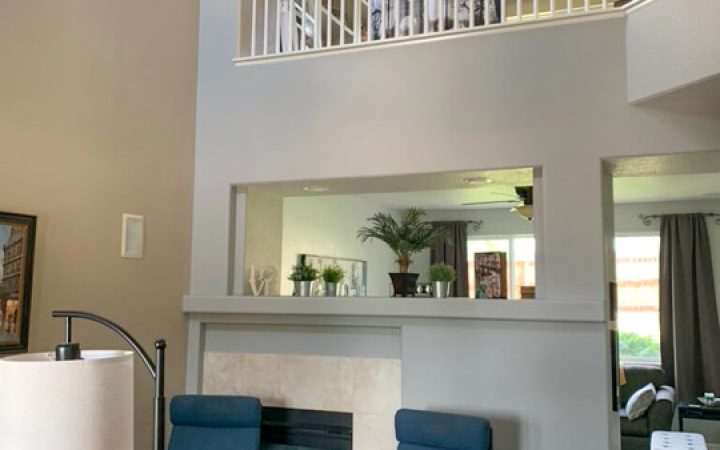 newly painted small living room and view of the second floor