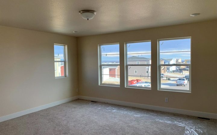 a renovated room freshly painted on the ceiling and walls